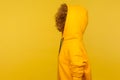 Side view of anonymous person with thick curly hair wearing urban style hoodie, sportive fashion clothe