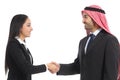 Side view of an arab saudi businesspeople handshaking