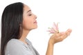 Side view of an arab woman smelling a flower Royalty Free Stock Photo