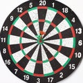 Side view.Arrow dart hitting the center of the target dart Board
