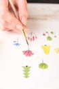 Side view of artist drawing flowers design at workplace Royalty Free Stock Photo