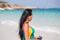 Beautiful asian woman with mobile phone at the beach Royalty Free Stock Photo