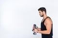 side view of athletic man working out with dumbbells Royalty Free Stock Photo