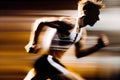 Side view of athletic runner with motion blur on city street Royalty Free Stock Photo