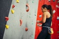 Side view of athletic woman climbing indoors Royalty Free Stock Photo