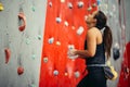 Side view of athletic woman climbing indoors Royalty Free Stock Photo