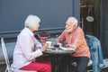 Mature couple communicating in cafe outside Royalty Free Stock Photo