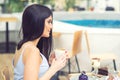 Side view of beautiful girl having coffee at cafe Royalty Free Stock Photo