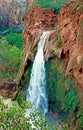 Side view of a beautiful Havasu Falls in Supai with foamy waters on a sunless day