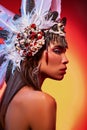 Side view of beautiful naked woman in tribal headdress Royalty Free Stock Photo