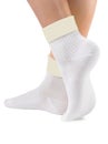 Side view of beautiful woman foot dressed in new nice and soft natural cotton fabric blank white socks Royalty Free Stock Photo