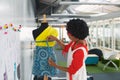 Female fashion designer using measuring tape on a mannequin in studio Royalty Free Stock Photo