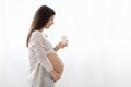 Beautiful pregnant woman holding glass of milk Royalty Free Stock Photo