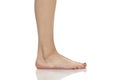 Side view of beautifully cared women`s feet on white background