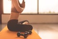 Side view beauty woman doing yoga and raise hand or pay obeisance in fitness workouts training gym center.  Lifestyle sport woman Royalty Free Stock Photo