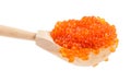 Side view of big wooden spoon with red caviar Royalty Free Stock Photo