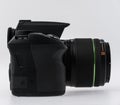 Side view of a black digital SLR camera.. Royalty Free Stock Photo