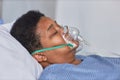 Side view of black senior woman with oxygen support mask Royalty Free Stock Photo