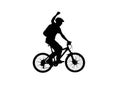 Side view on black silhouette of cyclist raising his hand in triumph and rejoicing in victory. Male bicyclist pedaling Royalty Free Stock Photo