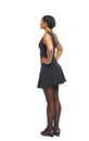 Side view of black woman in a brown dress Royalty Free Stock Photo