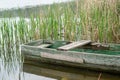 Side view of a boat in water with reflection