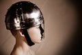 Side view of boy in warrior helmet