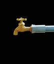 a brass water faucet isolated on black background. Royalty Free Stock Photo