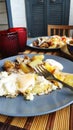 Side view breakfast for two, baked fish and potatoes with pickles, English breakfast, healthy eating concept, selective focus Royalty Free Stock Photo