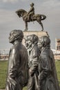 Side view of Bronze statue the Beatles stands at the Pier Head on the side of River Mersey