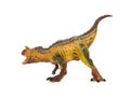 Side view brown carnotaurus toy on white background