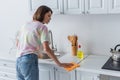 Side view of brunette woman cleaning Royalty Free Stock Photo