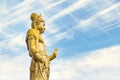 Side view of the Buddhist kannon bodhisattva on a sky background.