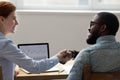 Diverse business people shaking hands in office Royalty Free Stock Photo