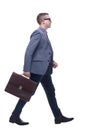 Side view business man holding brief case and walking Royalty Free Stock Photo