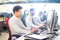 Side view of business people working on computers at office. Royalty Free Stock Photo
