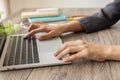 Side view of business woman typing laptop including  with blurred background and selective focus Royalty Free Stock Photo