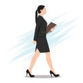 Side View of a Business Woman Walking with File Folder Royalty Free Stock Photo