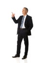 Side view businessman pointing upwards Royalty Free Stock Photo