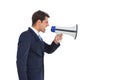 Side view of a businessman shouting on his megaphone Royalty Free Stock Photo