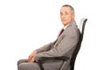 Side view of businessman sitting on armchair Royalty Free Stock Photo