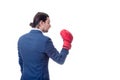 Side view businessman in suit with red boxing glove raised up stands ready in a fight stance. Office confrontation, serious