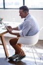 Side view of businessman using a tablet computer Royalty Free Stock Photo