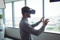 Side view of businessman using virtual reality glasses Royalty Free Stock Photo