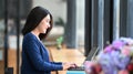 Businesswoman concentrate working on tablet computer at her modern workplace.