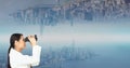 Side view of businesswoman looking at upside down city through binoculars Royalty Free Stock Photo