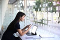 Businesswoman searching information on smartphone and working with tablet computer at her workstation. Royalty Free Stock Photo