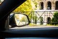 Side view car mirror in sunset ancient city Rome panorama Royalty Free Stock Photo