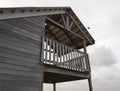 Side view Caribbean wood construction with its island-style architecture with a high ceiling and wooden facade. Urbanism and Royalty Free Stock Photo