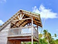 Side view Caribbean wood construction with its island-style architecture with a high ceiling and wooden facade. Urbanism and Royalty Free Stock Photo