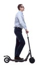 Side view. casual man with electric scooter looking at you Royalty Free Stock Photo